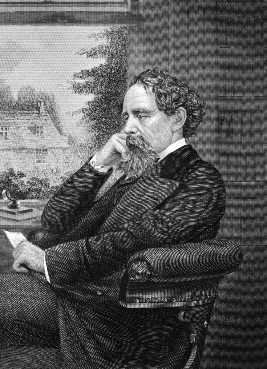 Charles Dickens seated in profile, facing left